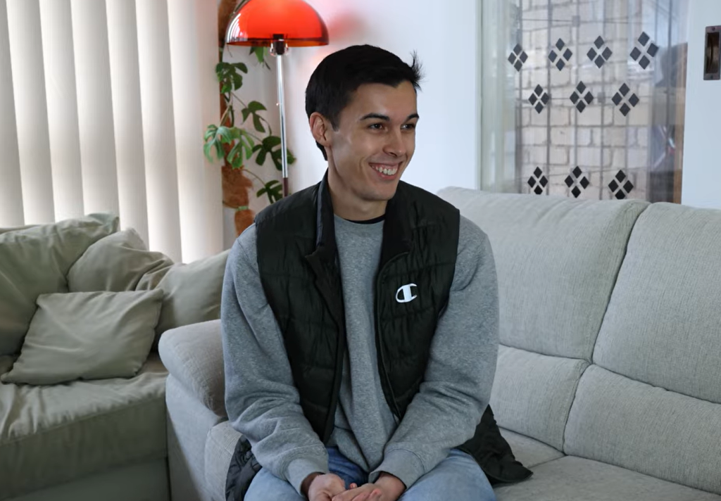 Jack smiles in his home as the Council Home Energy Program team ask him about his home energy assessment.
